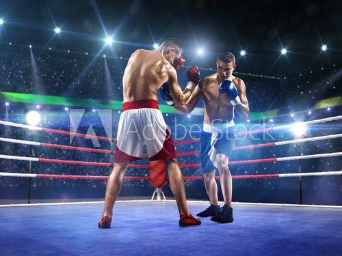 Fototapeta Dwaj zawodowi bokserzy walczą na arenie