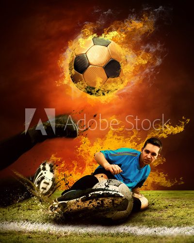 Fototapeta Gracz futbolu w ogieniu płonie na outdoors polu