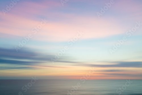 Fototapeta Niewyraźne niewyraźne tło zachód słońca niebo i ocean natura.