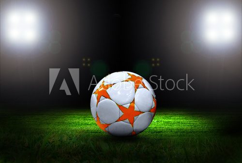 Fototapeta Piłka na polu stadionu światłem
