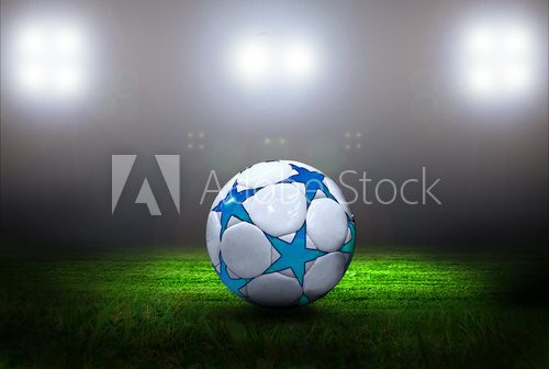 Fototapeta Piłki nożnej piłka na polu stadium z światłem