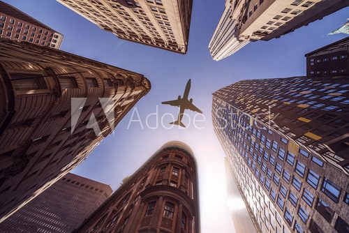 Obraz samolot nad budynkami gródów