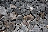 Fototapeta Czarna lawa kamienia wulkanicznego muru