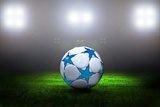 Fototapeta Piłki nożnej piłka na polu stadium z światłem