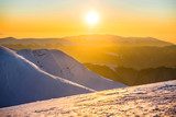 Fototapeta Zachód słońca w górach zimą
