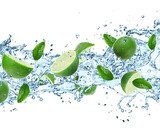 Obraz Limonki i plusk wody nad białym