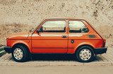 Obraz Retro auto na brukowanej ulicy